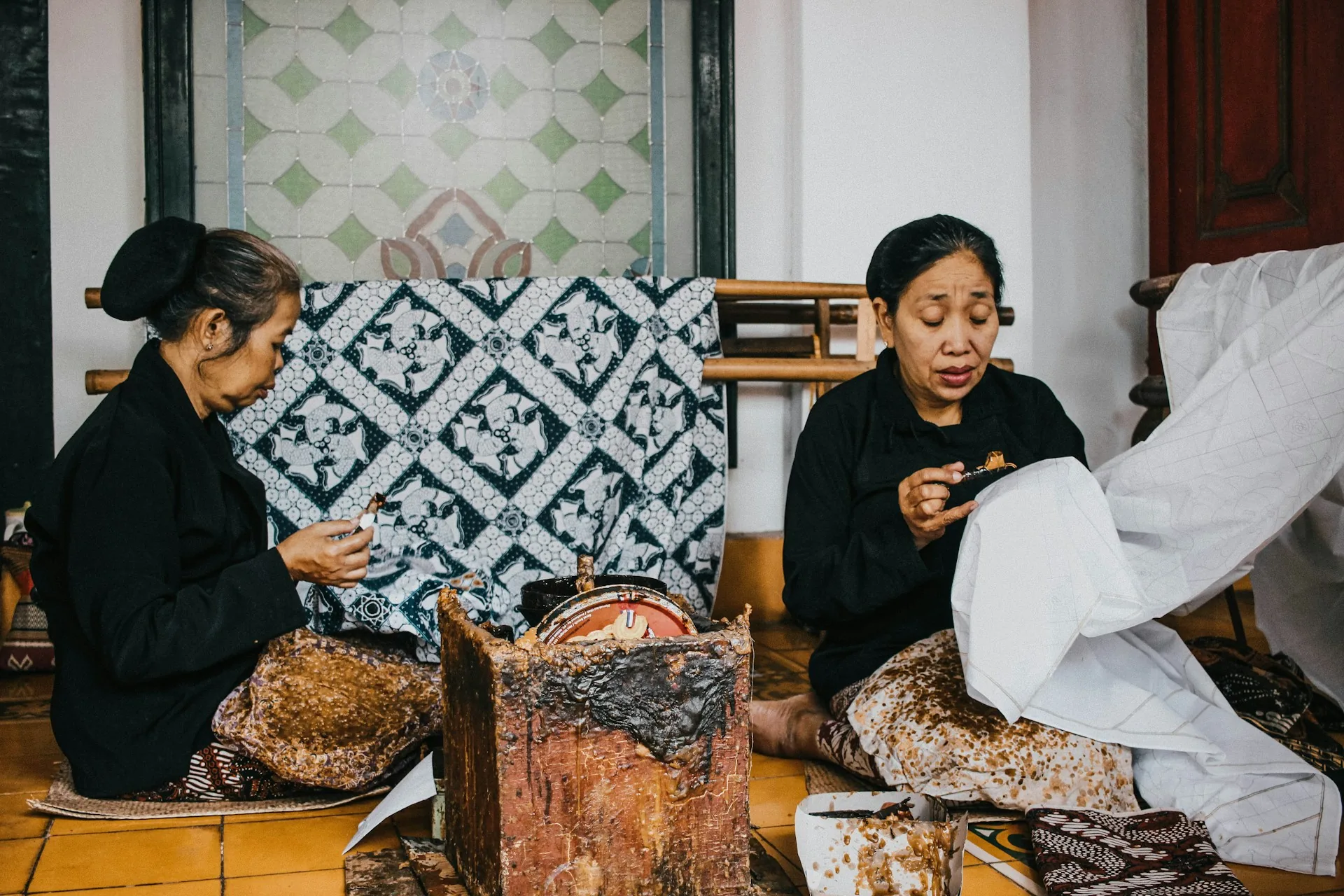 Batik artisans working with patterned cloth in Yogyakarta